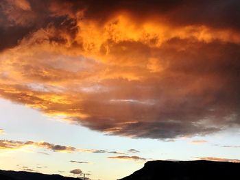 Low angle view of cloudy sky during sunset