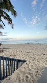 Scenic view of beach against sky during sunset