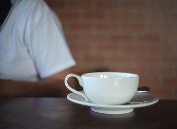 Close-up of coffee cup on table