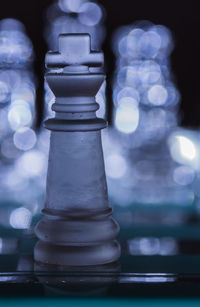 Close-up of chess pieces on table