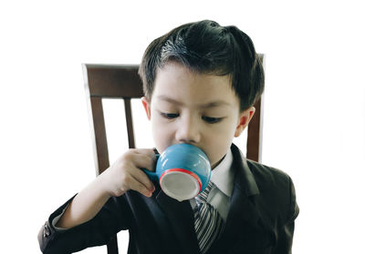 Close-up of boy drinking coffee