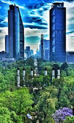 Buildings against cloudy sky