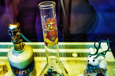 Close-up of beer bottles on table