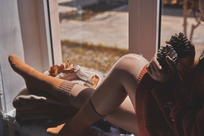 Woman sitting in window