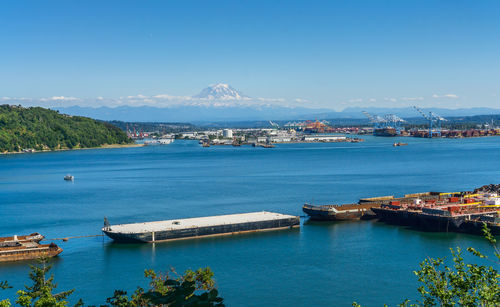 Mount rainier with little snow in summer and the port of tacoma.