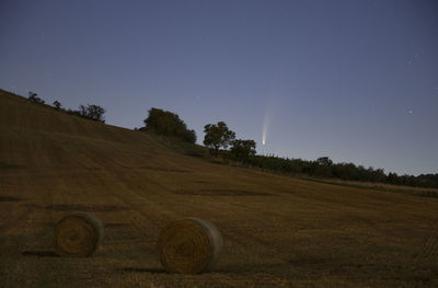 Scenic view of field against sky at night