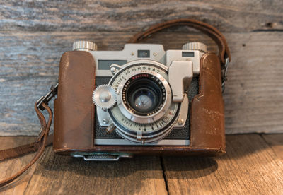 Close-up of old-fashioned camera on table