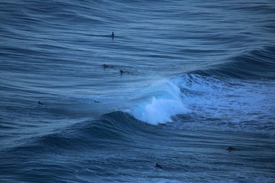 People surfing in ocean