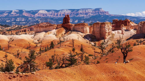 Panoramic view of landscape with mountain range in background