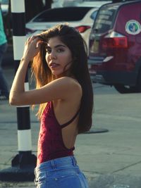 Portrait of young woman standing outdoors