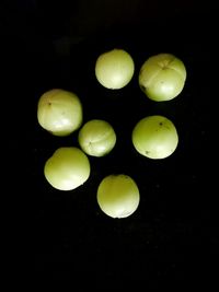 Close-up of fruits against black background