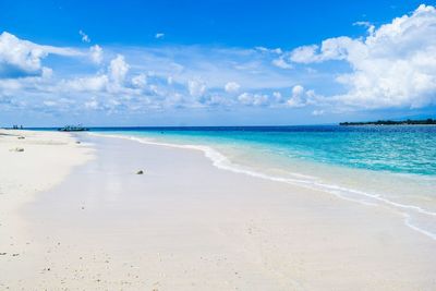 Scenic view of sea against blue sky