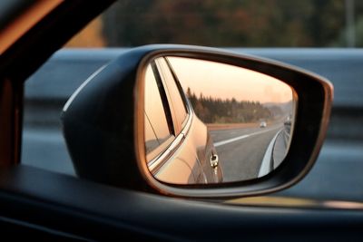 Reflection of car on side-view mirror