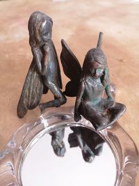 High angle view of statue on table