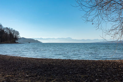 Scenic view of sea against blue sky