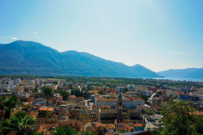 High angle view of townscape and mountains against sky