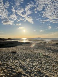 Scenic view of sea against sky during sunrise 