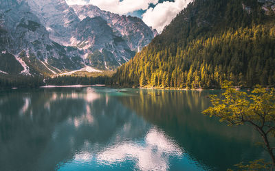 Scenic view of lake and mountains against sky