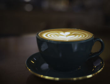 Close-up of coffee cup on table