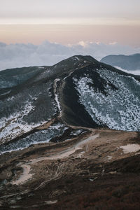 Scenic view of mountain against sky during sunset