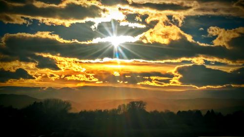 Sun shining through clouds