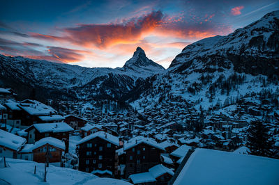 Scenic view of snowcapped mountains against sky during winter