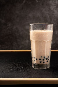 Close-up of coffee in glass on table