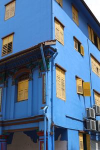 Low angle view of building against blue sky