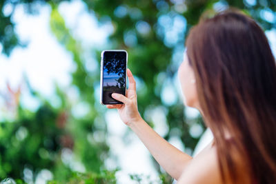 Young woman using mobile phone