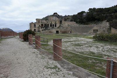 Old ruin building against cloudy sky