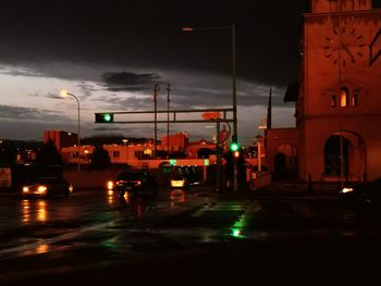 Illuminated city street at night