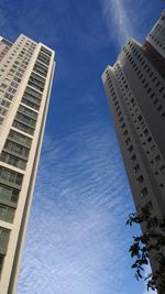 Low angle view of buildings against blue sky