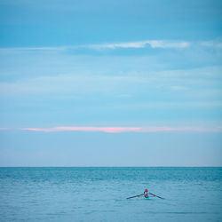 Scenic view of sea and oar against sky