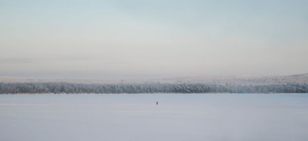 Scenic view of snow covered landscape against sky