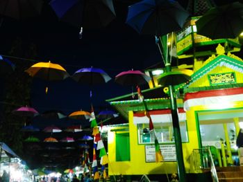 Low angle view of multi colored lights