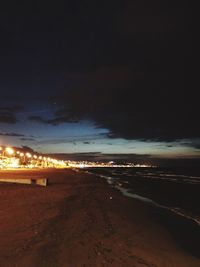 Scenic view of beach against sky at night