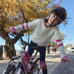 Portrait of smiling girl on bicycle
