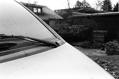 Close-up of car on roof against sky