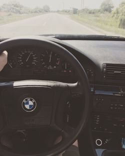 Cropped image of car on road