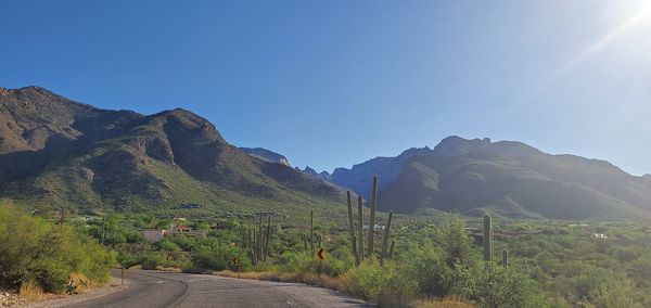 Scenic view of mountains against clear blue sky