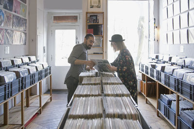 Young couple shopping for records together