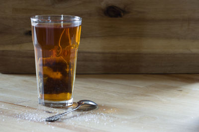 Close-up of beer glass on table