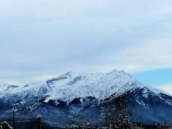 Scenic view of snowcapped mountains against sky