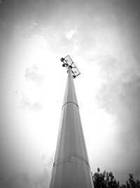 Low angle view of communications tower against sky