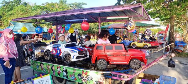 Group of people at market stall