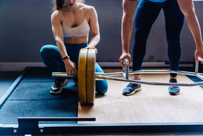 Low section of woman exercising in gym