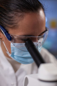 Close-up of woman using mobile phone