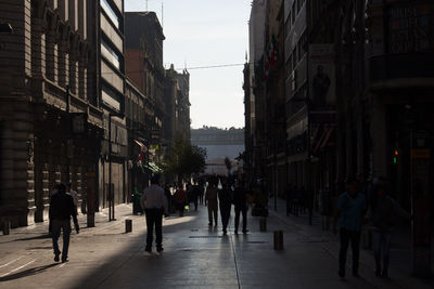 People walking on street in city