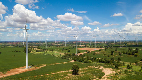 Aerial landscape of windmills farm with white sky on blue sky at huai bong, 