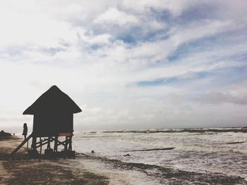 Scenic view of sea against cloudy sky